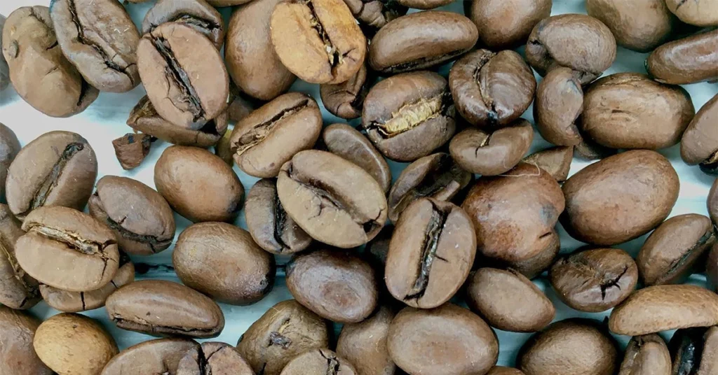 Close up coffee beans on a white cloth